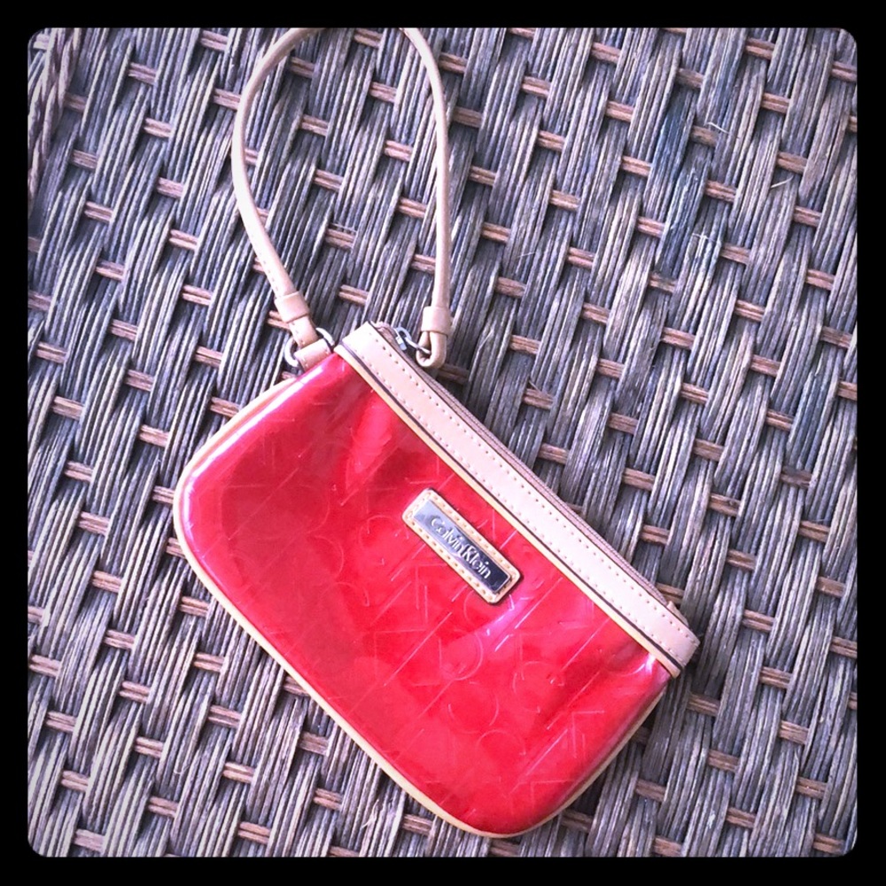 Calvin Klein shiny red logoprint wristlet- used 1x
